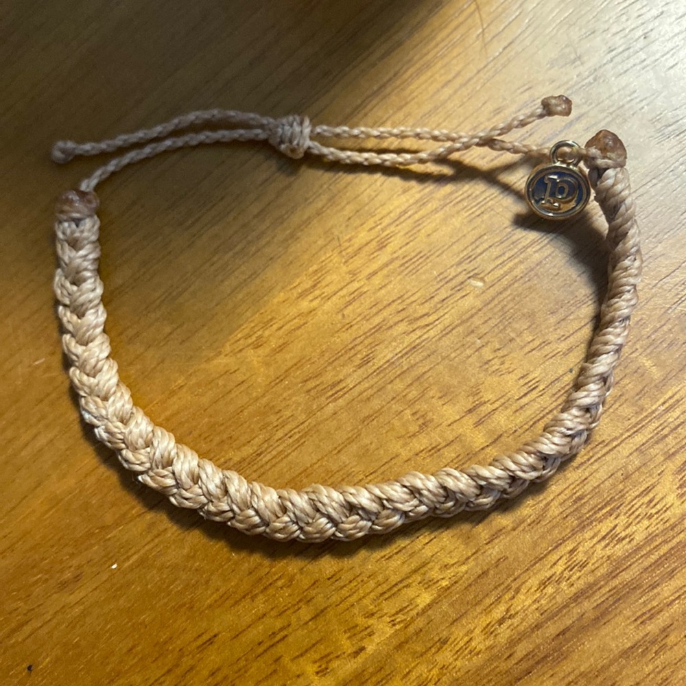 Burgundy colored pura vida bracelet never worn